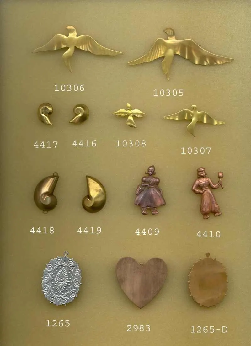Catalog sheet of brass findings: birds in flight, shells, figure charms, a filigree oval and a heart blank, each with its part number