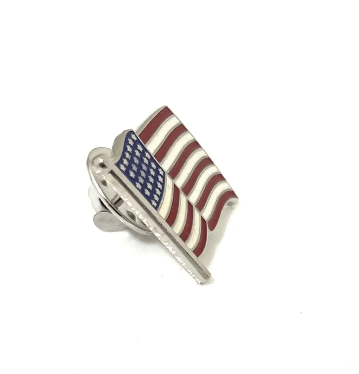 An American flag lapel pin shown at an angle with its clutch back