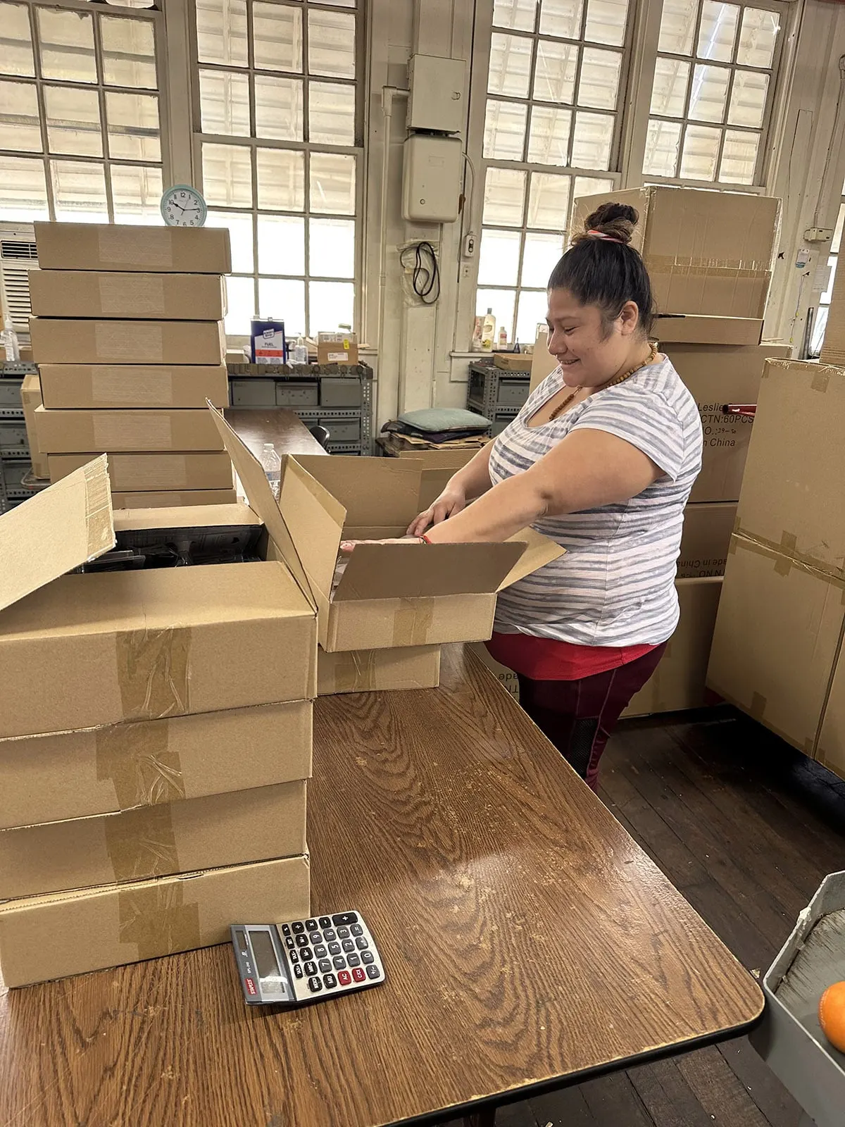 Finished orders being packed into cartons for shipment