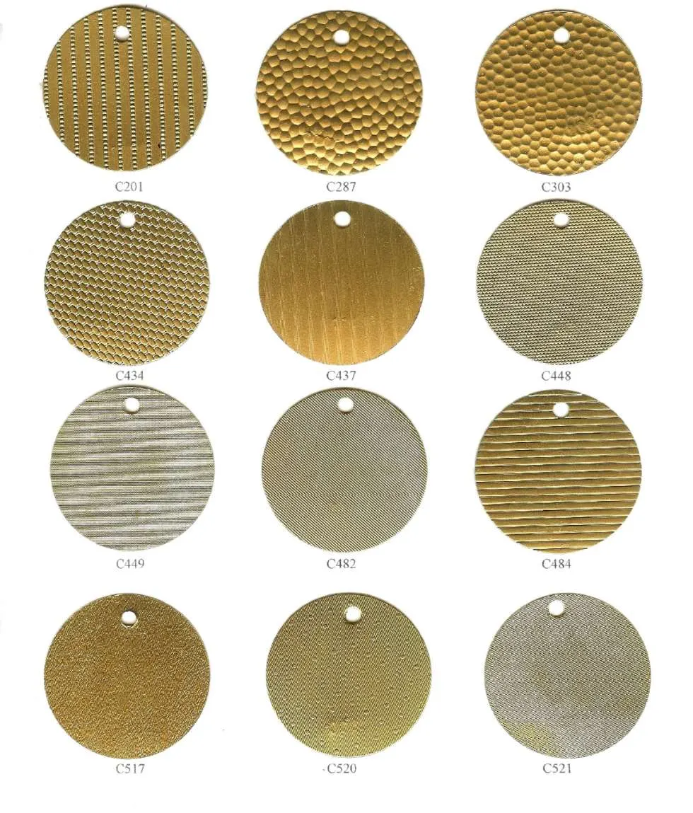 Catalog page of embossed pattern stock discs in brass and silver tones, part numbers C201 to C521