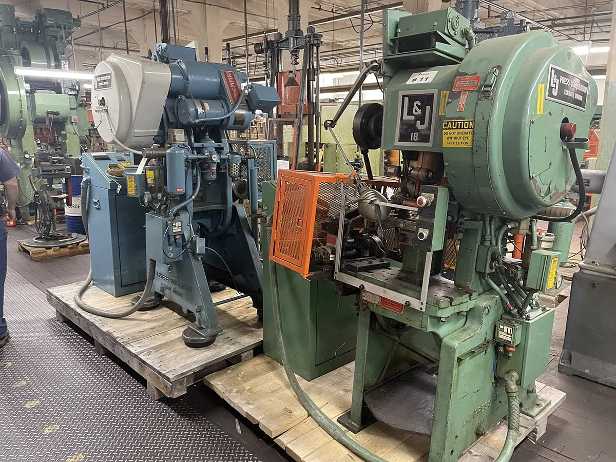 Mechanical punch presses lined up on the press floor