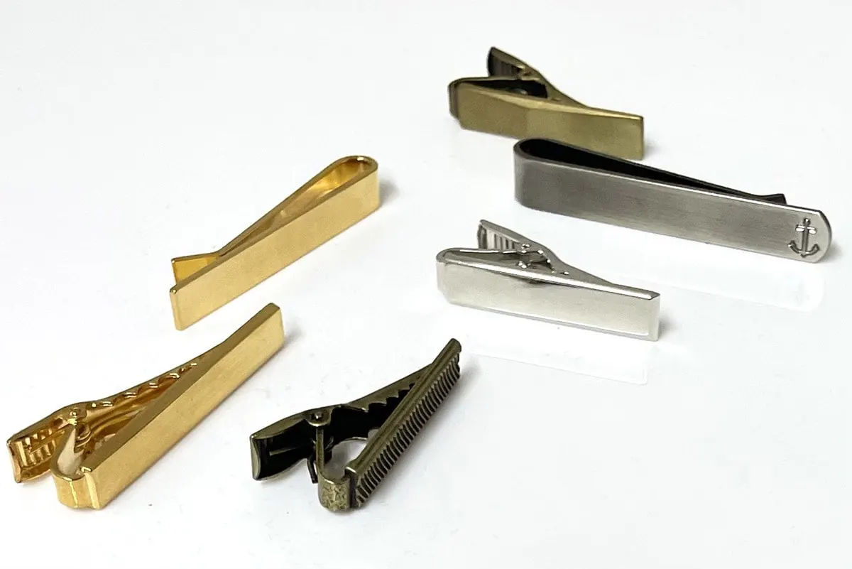 Stamped tie bars in gold, silver, gunmetal and antique brass finishes